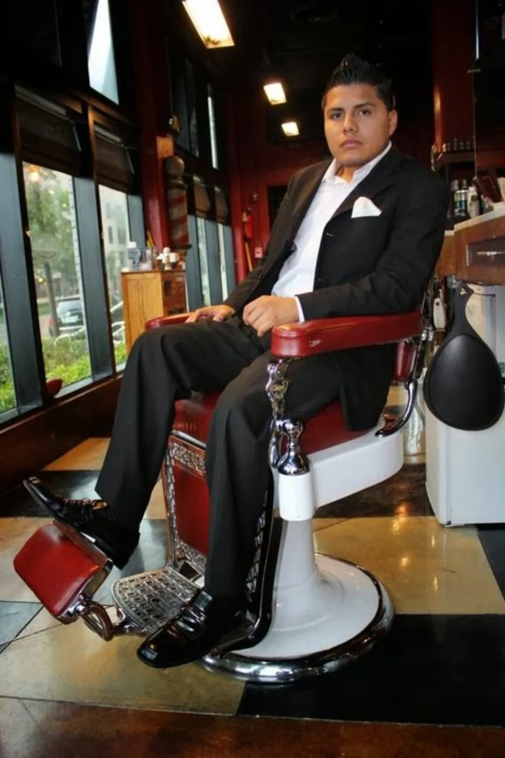 Founder seated in barber chair
